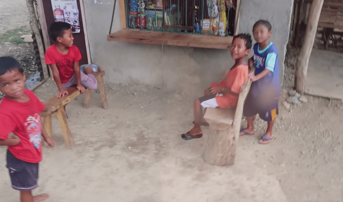 filipino kids running at stand in catanduanes province philippines